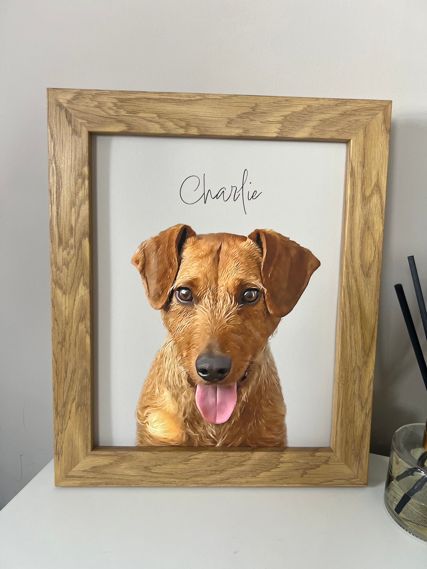 A custom digital pet portrait of an Irish Terrier dog named Charlie, displayed in a wooden frame.