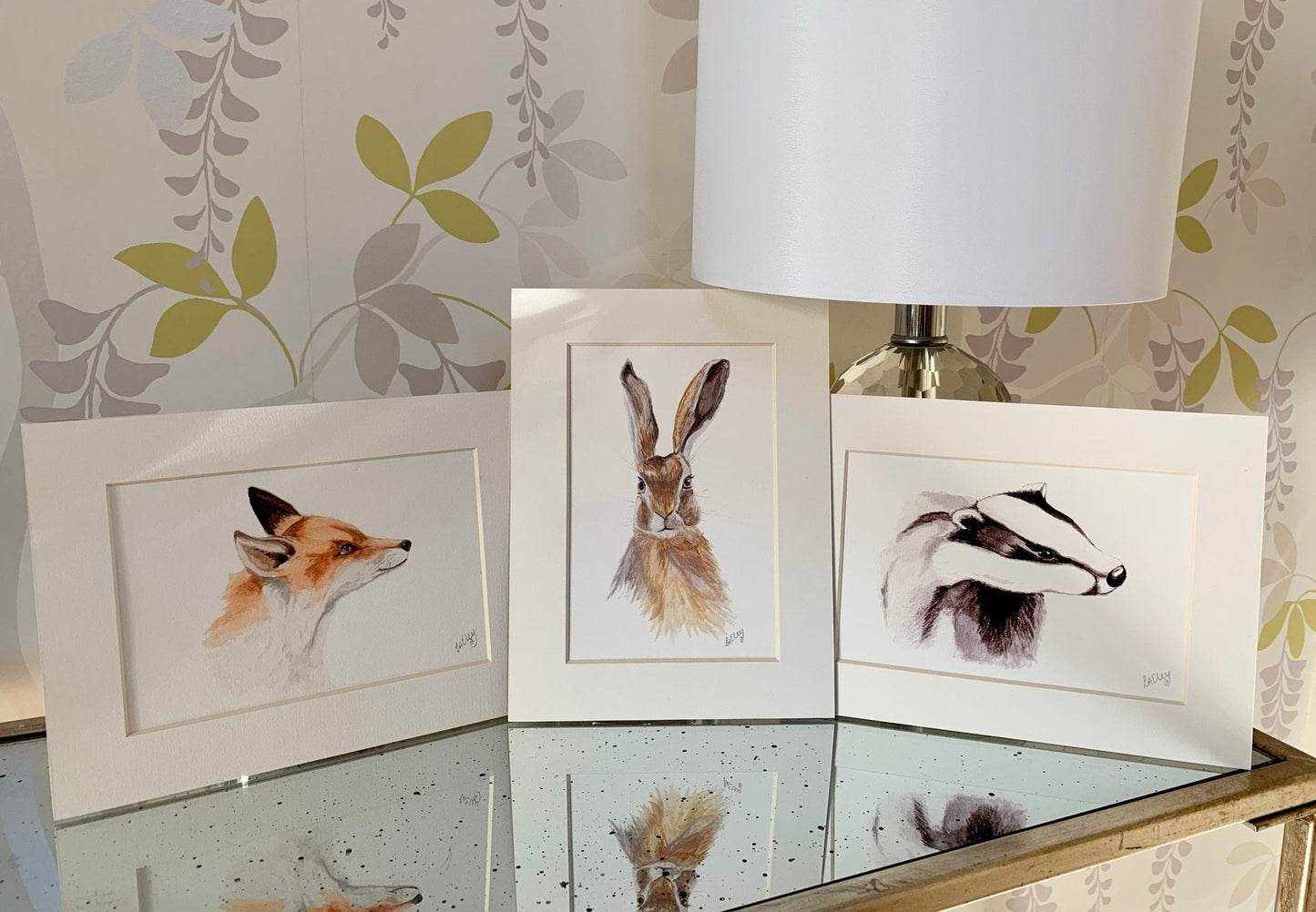 Set of 3 Watercolour hare, fox and badger paintings with white mounts.