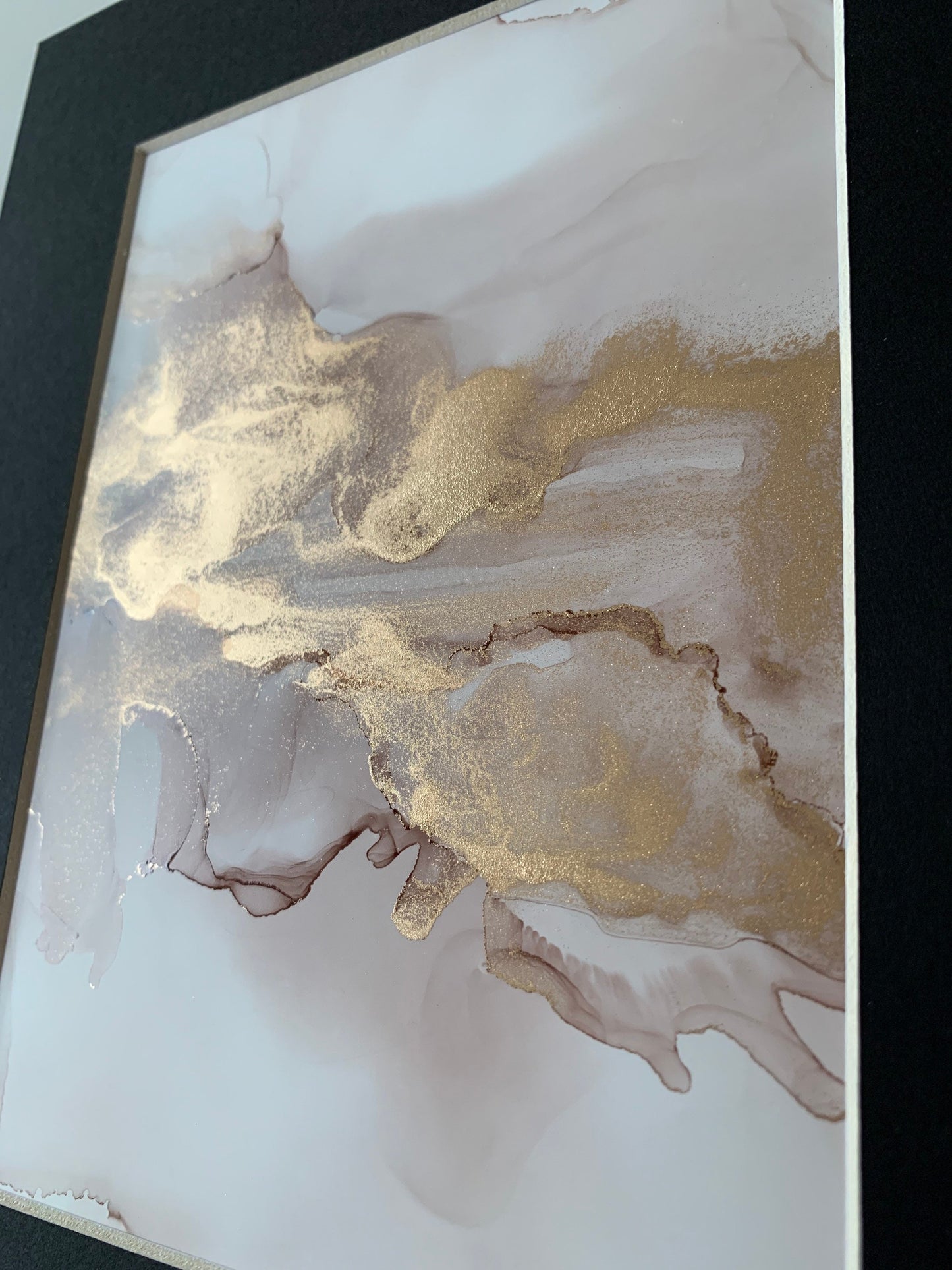 An A5 size contemporary ink painting with pink and gold metallic colours.