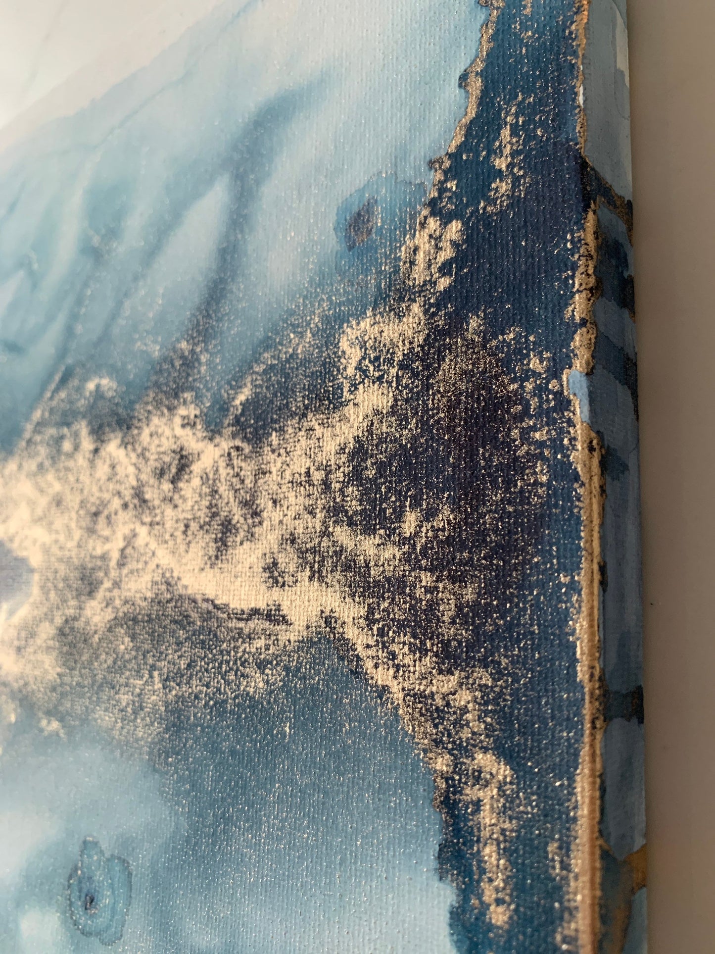 An abstract ink painting featuring a glowing gold horizon over a midnight blue sky.