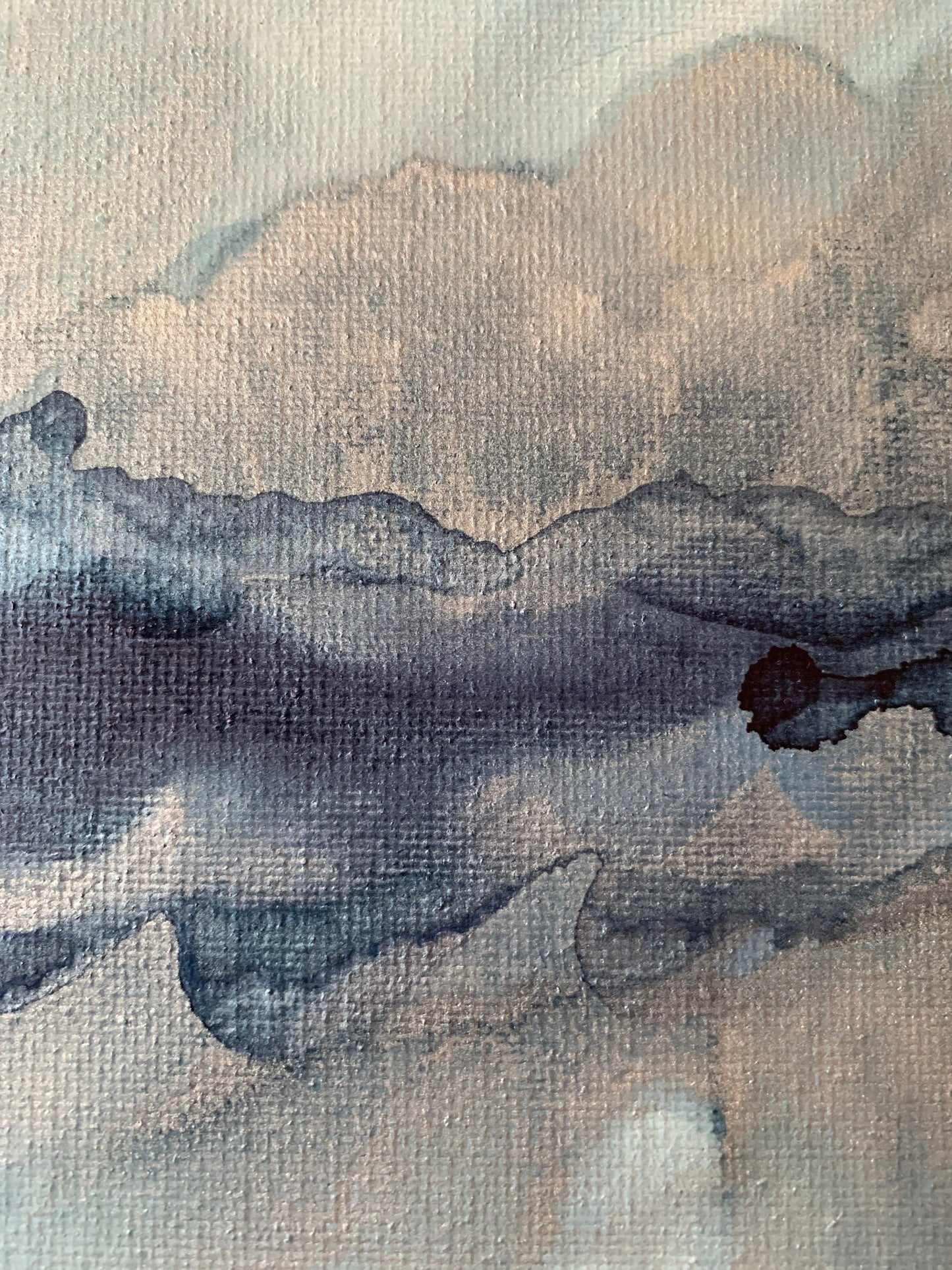 Close up of an original 8x10 inch abstract alcohol ink artwork on canvas with shades of blue and silver.