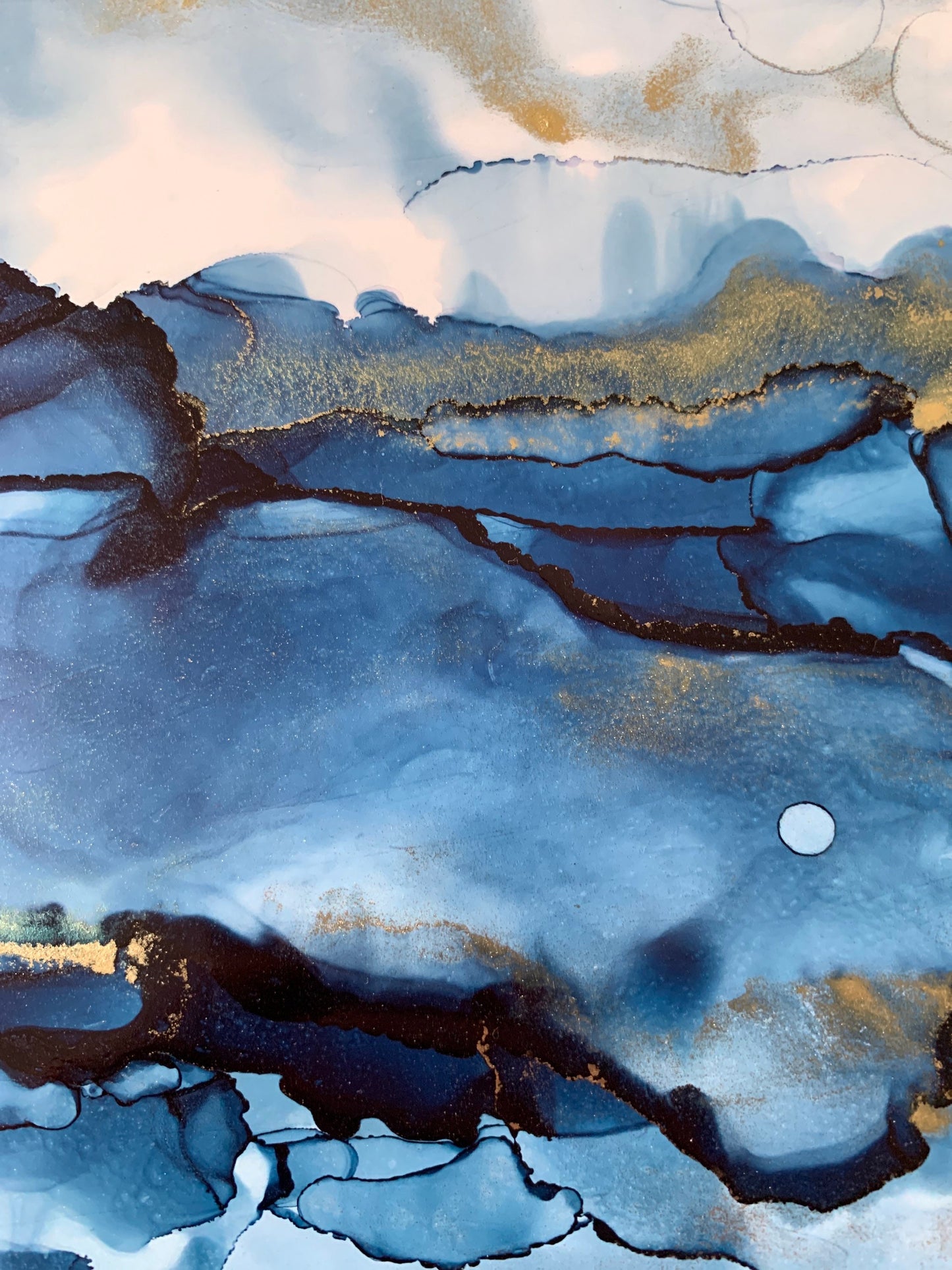 An A5 size contemporary ink painting featuring blue and metallic colours with gold shimmers, presented in a black mount.