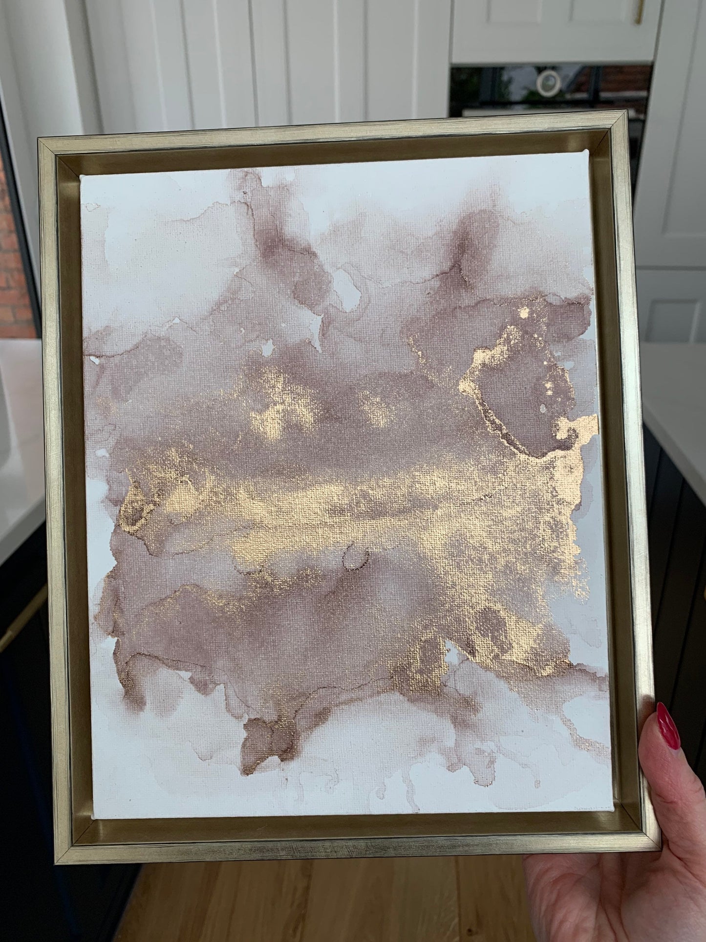 A 10x8 inch canvas with blush pink and gold metallic ink in an alcohol paint style, presented in a gold frame.