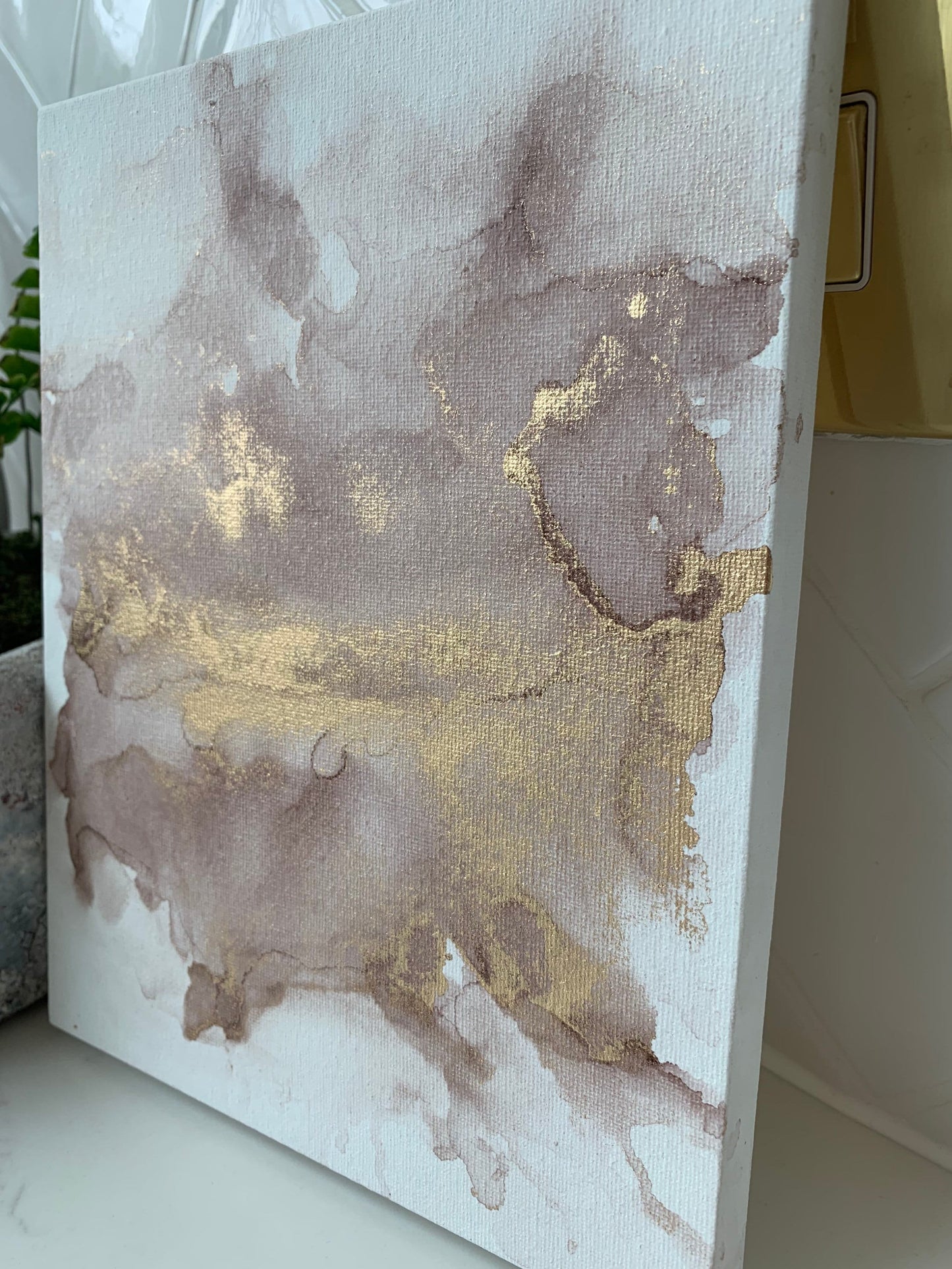 A 10x8 inch canvas with blush pink and gold metallic ink in an alcohol paint style.