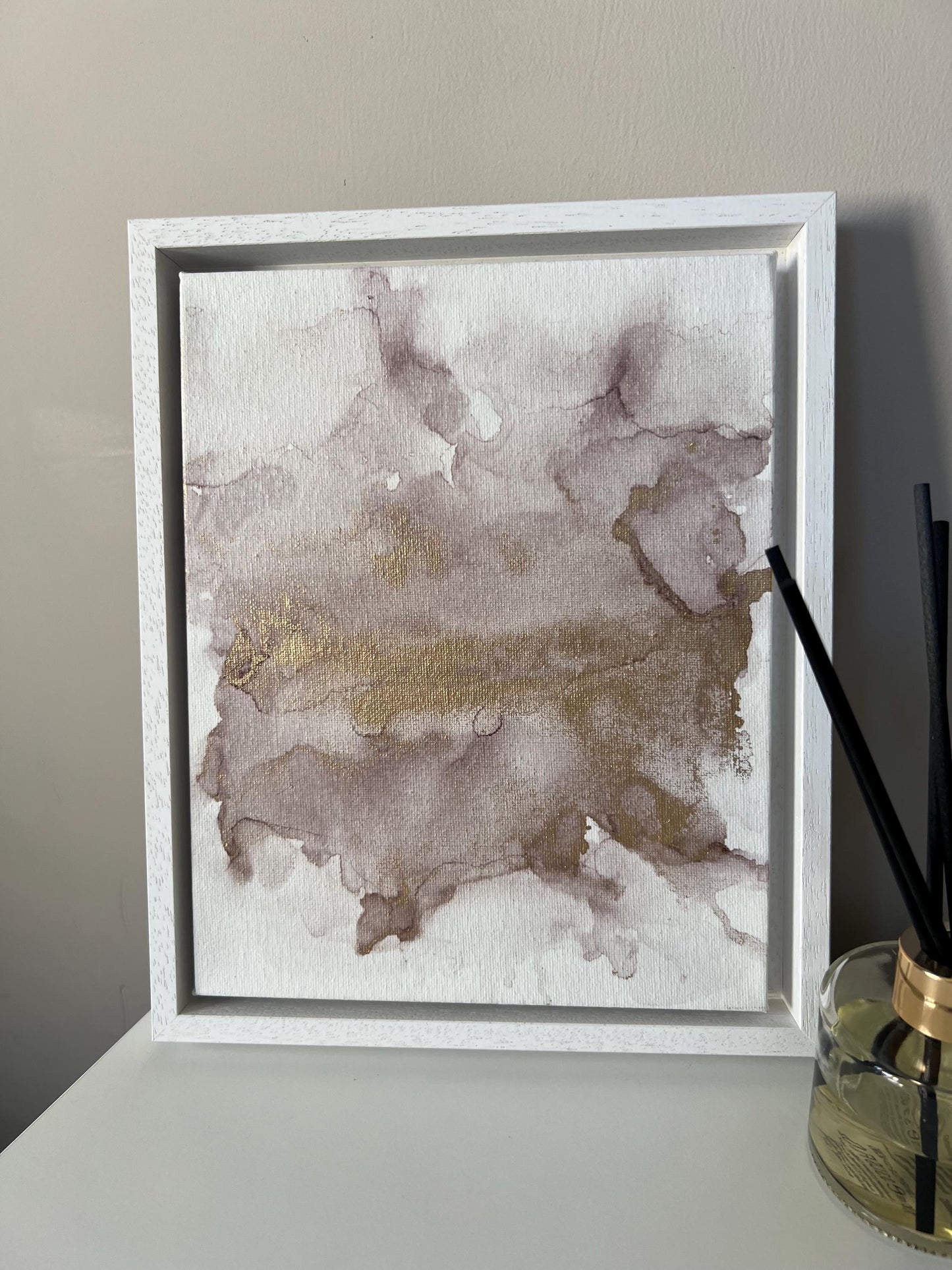 A 10x8 inch canvas with blush pink and gold metallic ink in an alcohol paint style, presented in a white frame.