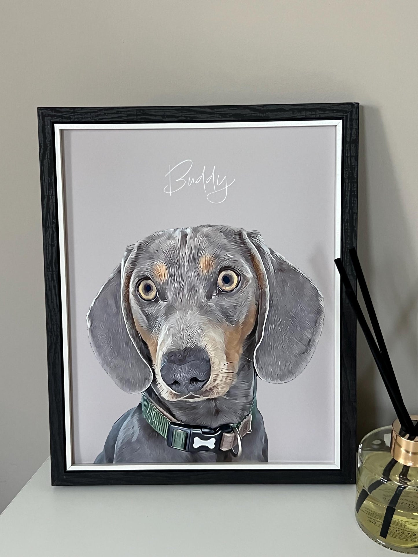 A custom digital pet portrait of a dachshund dog named Buddy, displayed in a wooden frame with and grey background.