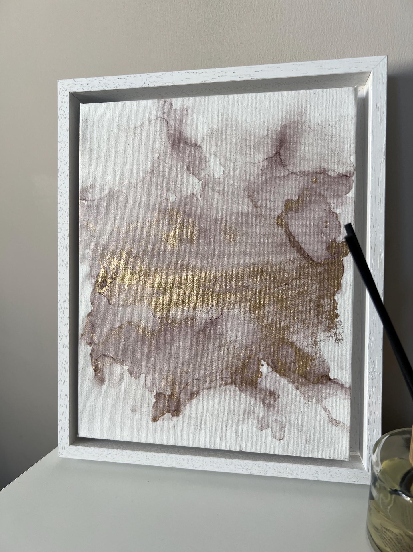 A 10x8 inch canvas with blush pink and gold metallic ink in an alcohol paint style, presented in a white frame.