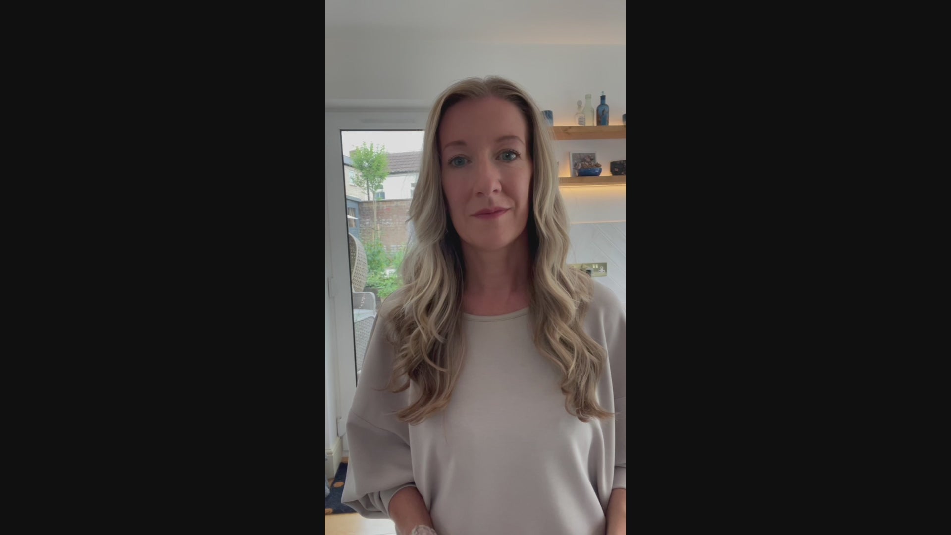 Video of an artist showing the process to create a digital pet portrait from a photo of a dog.