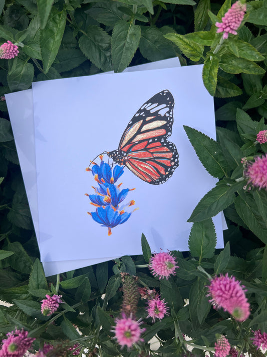 Monarch Butterfly illustration card with gold glitter accents on a white card with flowers and leaves around