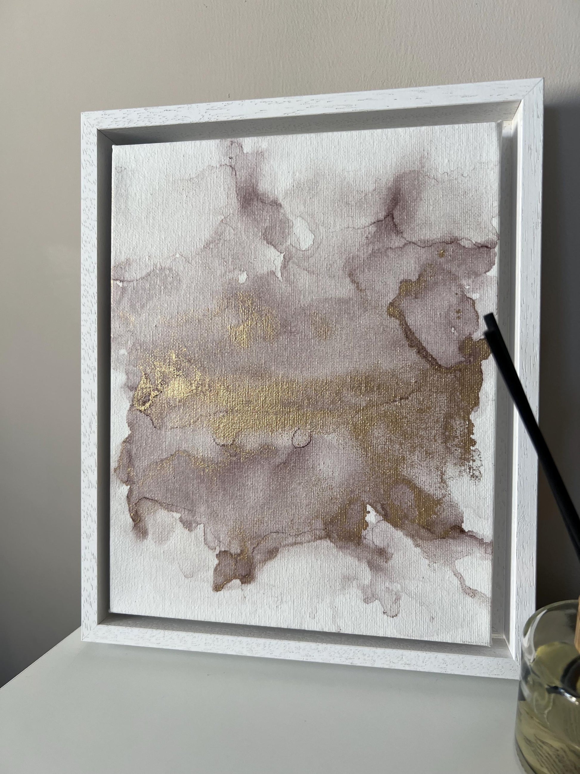 A 10x8 inch canvas with blush pink and gold metallic ink in an alcohol paint style, presented in a white frame.
